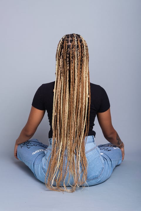 Woman with braids in studio